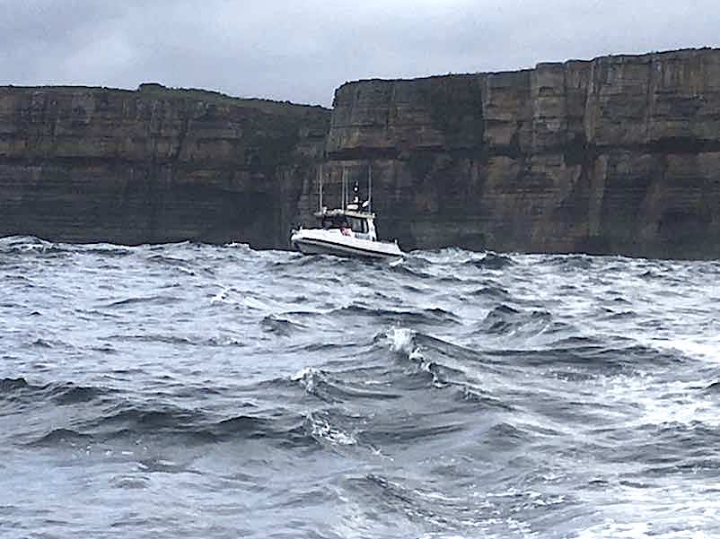 Marine Rescue Volunteers working under difficult conditions